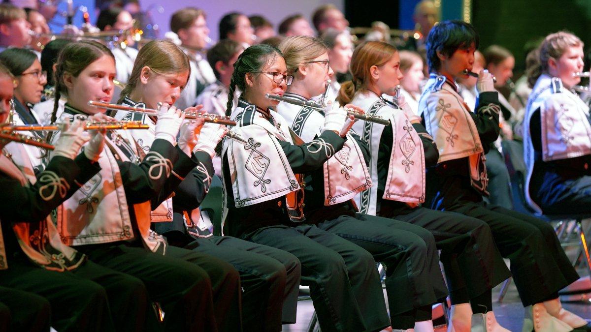 marching band students playing indoor concert